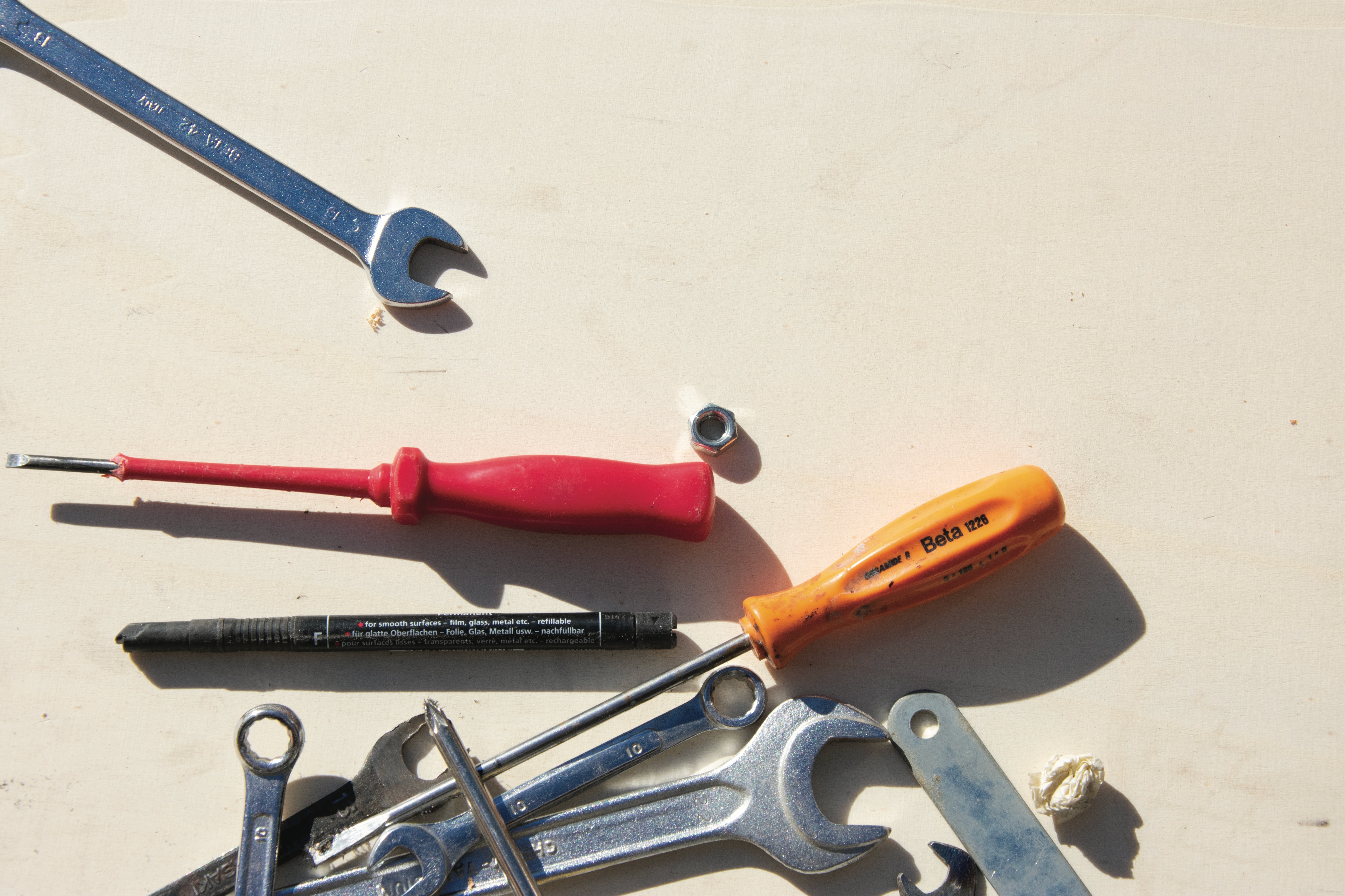 Various tools scattered on a white background. 